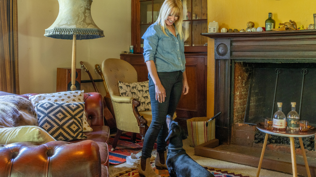 Woman with dog in livingroom